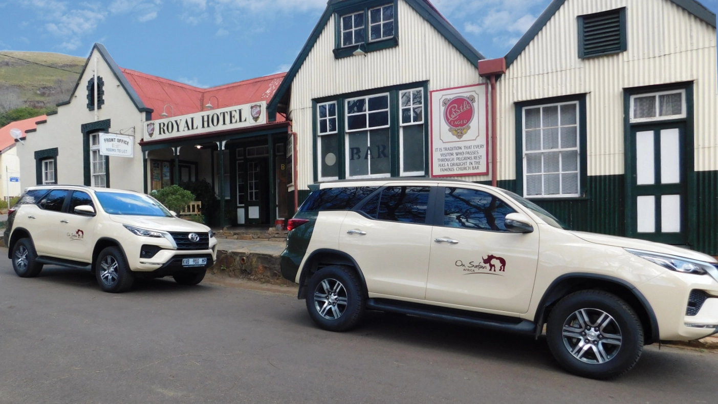 On Safari Africa transfer vehicles ahead of a lodge pickup
